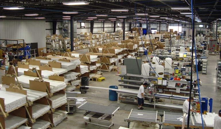 Sunburst shutters being assembled in the factory.